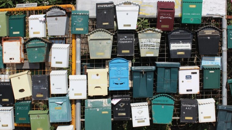 Post boxes on a fence