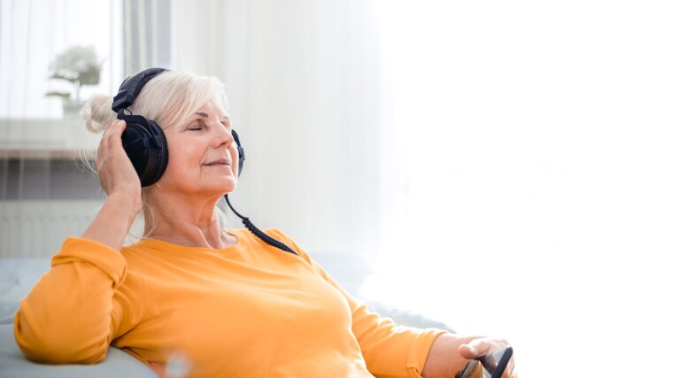 relaxed-senior-woman-listening-her-favourite-music